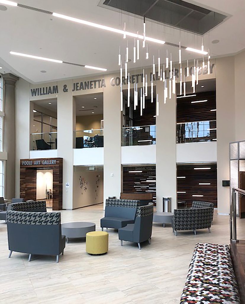 Center for the Arts lobby featuring a dimensional slatted wood donor recognition display integrated into the surrounding architecture.