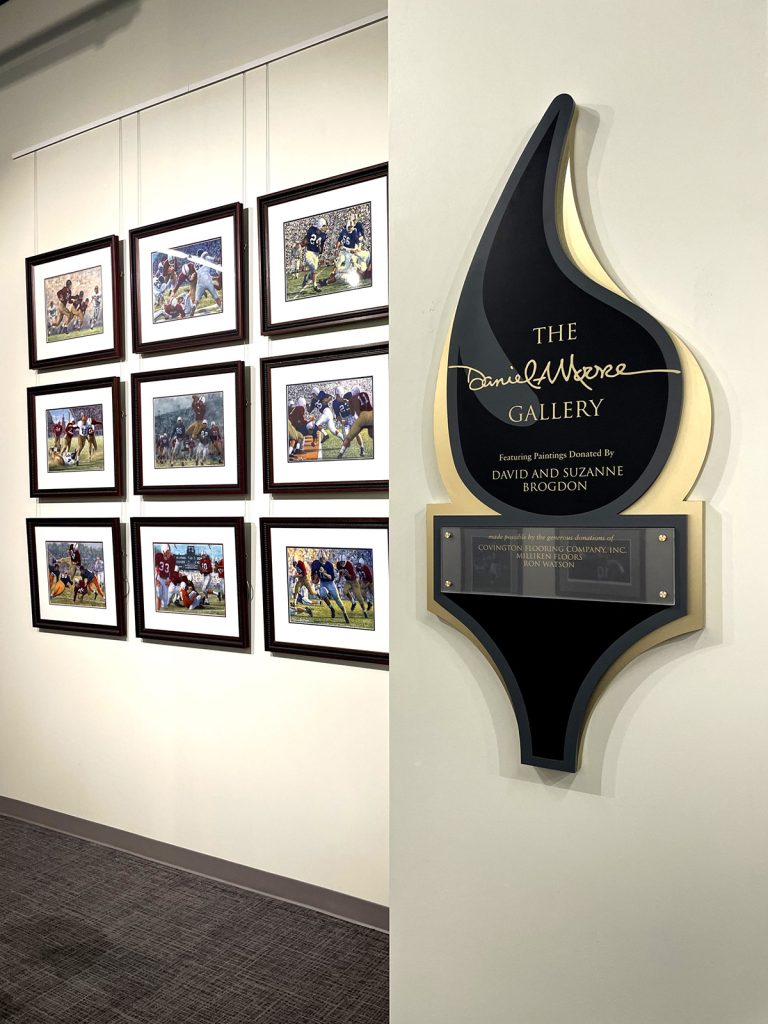 Clear Change plaque for Alabama Sport Hall of Fame in the shape of the organization's torch logo.