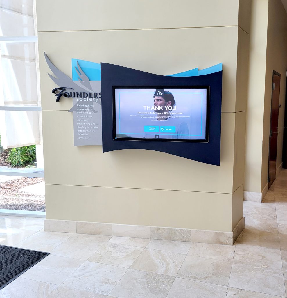 Interactive Founders Society donor recognition display in the UNF Alumni Hall lobby.