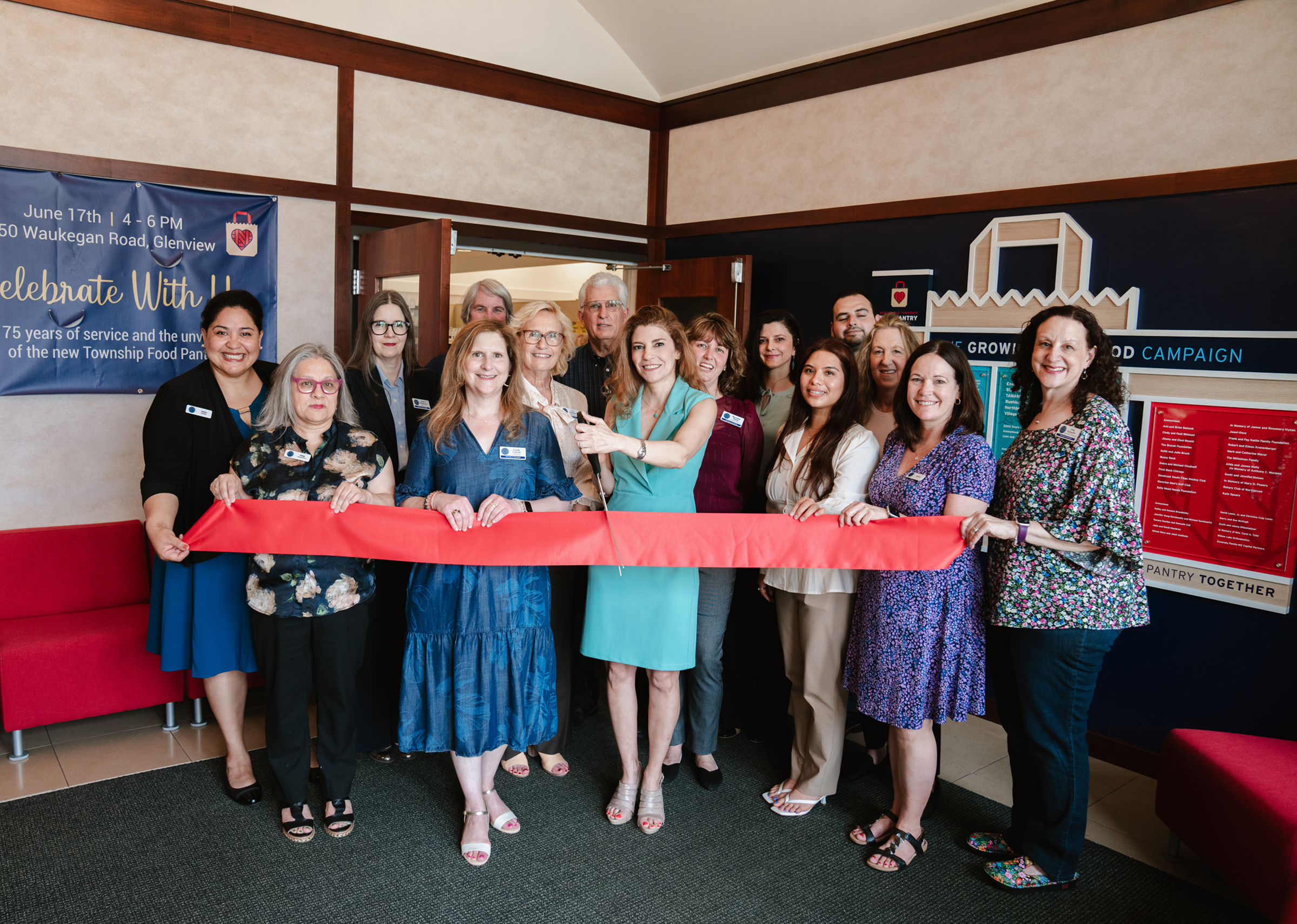 A ribbon cutting to celebrate Installed Growing for Good donor wall by Partners in Recognition at Northfield Township Food Pantry
