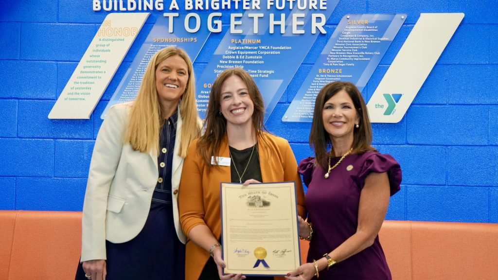 Guests celebrate the opening of the YMCA addition and unveiling of the new donor wall.