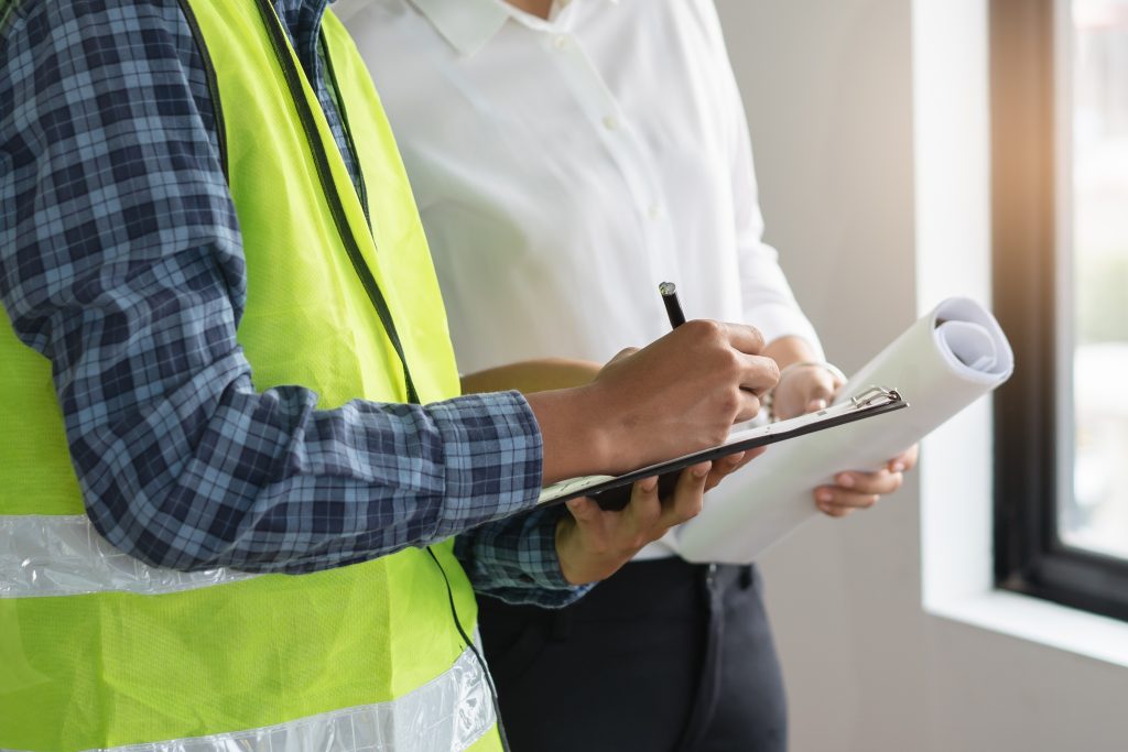 A Partners In Recognition consultant reviewing installation information with a client.