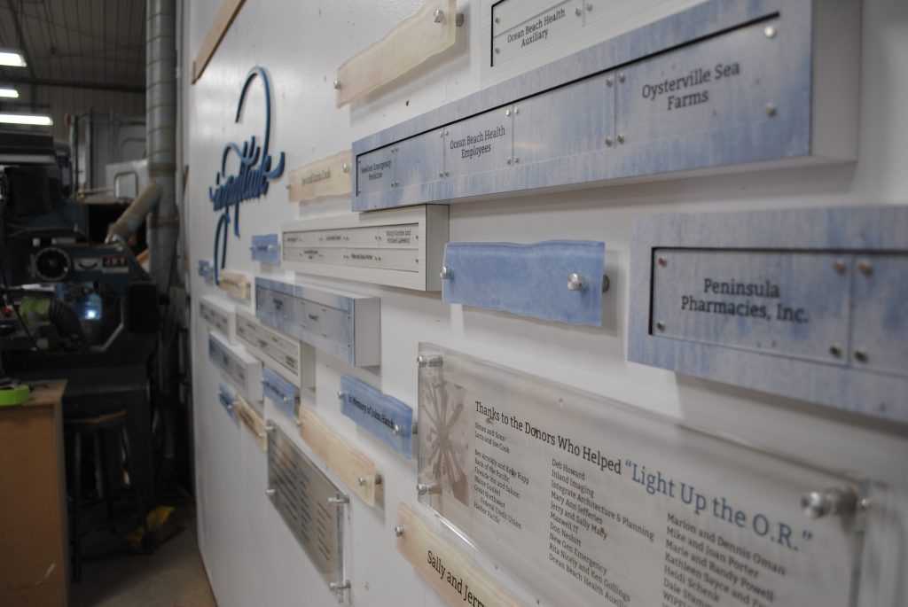 A close-up, side view of a modular donor recognition display that shows hierarchy of donor levels and attention to detail.