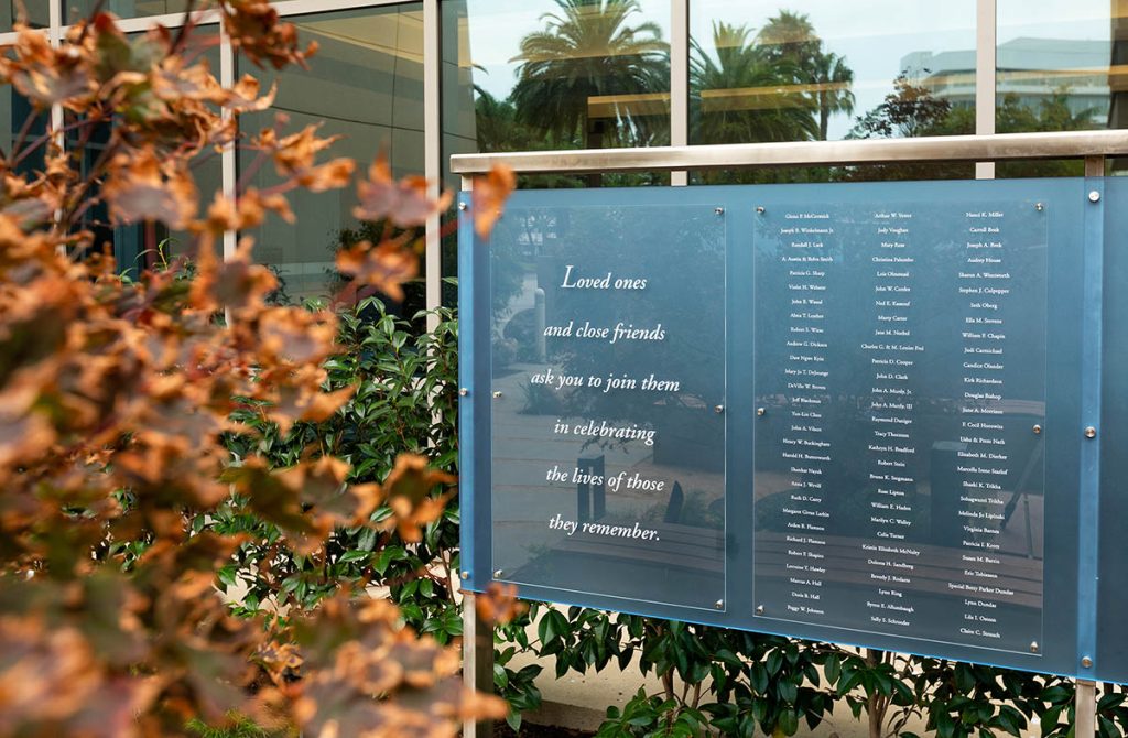 Outdoor memorial display with quote panel and names on blue 3-Form at Hoag Hospital garden
