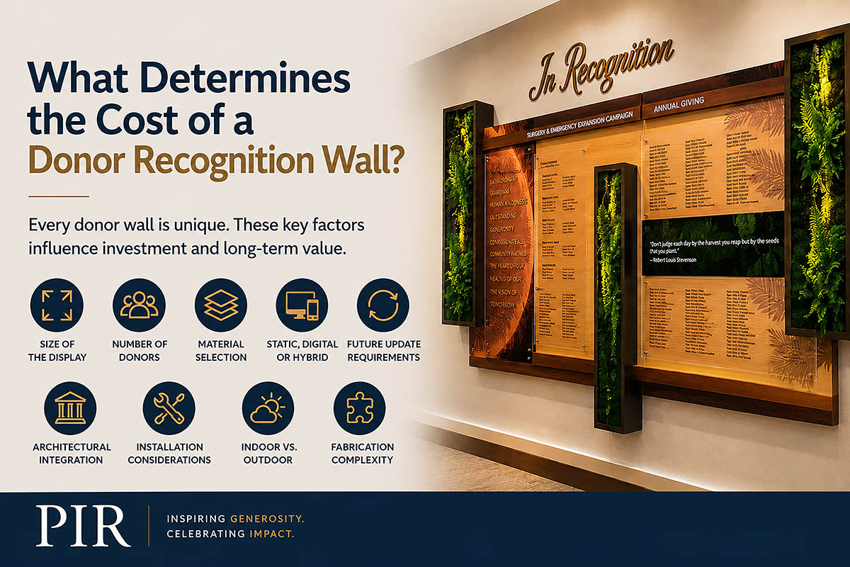 Custom donor recognition wall featuring dimensional wood elements, acrylic donor panels, and integrated display components illustrating factors that influence donor recognition wall cost.