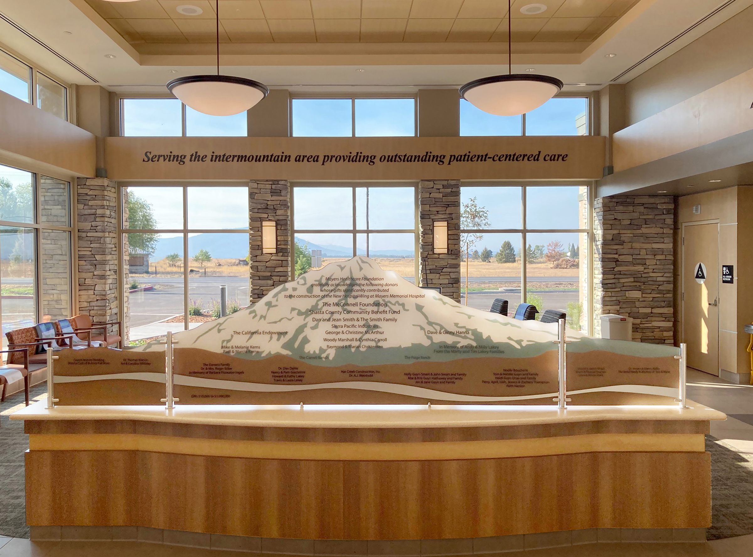 Healthcare donor recognition display installed at Mayers Intermountain Healthcare featuring an etched acrylic mountain landscape inspired by Northern California.