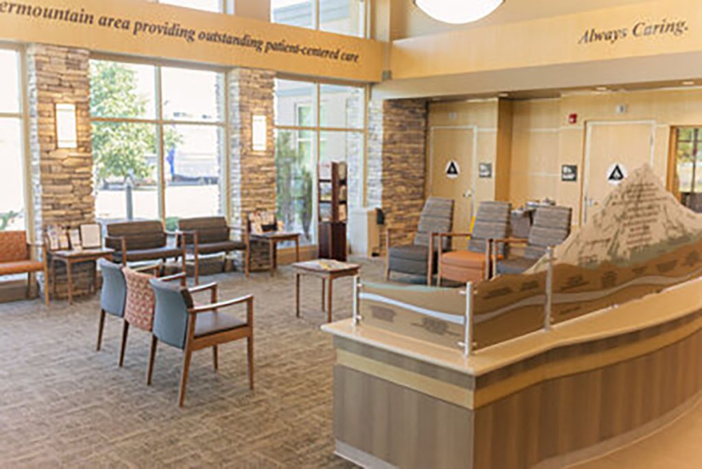 Healthcare donor recognition display integrated into the hospital lobby at Mayers Intermountain Healthcare, complementing the reception and patient waiting area.
