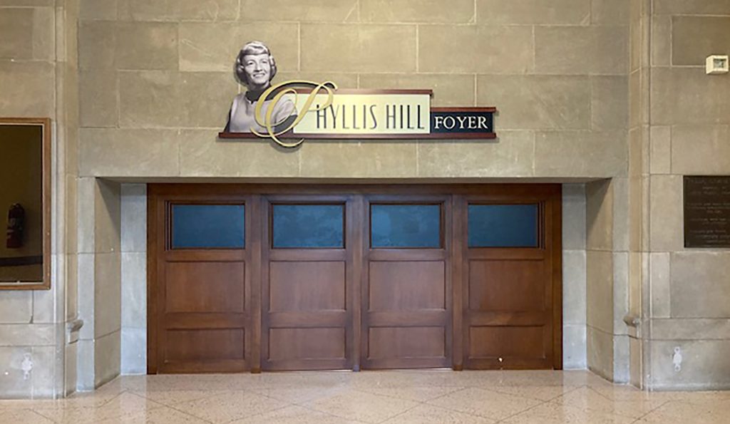 Major donor recognition above a doorway in a higher education area.