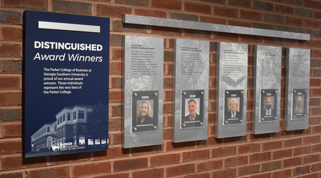 Recognition display that honors Distinguished Award Winners for Research, Teaching, Service, Professors & Staff.